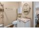 Updated half-bath with granite vanity and stylish fixtures at 5833 Wembley Dr, Douglasville, GA 30135