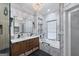 Modern bathroom with double vanity, soaking tub, glass enclosed shower, and stylish fixtures at 5833 Wembley Dr, Douglasville, GA 30135