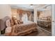 Comfortable bedroom with decorative lamps, full-length mirrors, and plush bedding for a relaxing retreat at 5833 Wembley Dr, Douglasville, GA 30135
