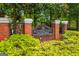 Kensington Swim & Tennis community entrance sign framed by lush greenery at 5833 Wembley Dr, Douglasville, GA 30135
