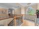 Second floor foyer with chandelier and a beautiful arch window illuminating the staircase with natural light at 5833 Wembley Dr, Douglasville, GA 30135