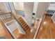 Grand foyer showcasing hardwood staircase, detailed molding, and an open view into the main living area at 5833 Wembley Dr, Douglasville, GA 30135