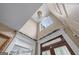 High ceiling foyer featuring a chandelier, decorative trim, and a bright, airy feel at 5833 Wembley Dr, Douglasville, GA 30135