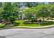 A picturesque home featuring a lush front yard and mature shade trees at 5833 Wembley Dr, Douglasville, GA 30135