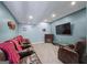 Cozy home theater features comfortable seating, a large screen, and ambient lighting for an immersive experience at 5833 Wembley Dr, Douglasville, GA 30135