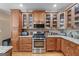Modern kitchen with stainless steel appliances, custom cabinetry, and granite countertops at 5833 Wembley Dr, Douglasville, GA 30135