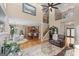 Inviting living room open to the kitchen, featuring hardwood floors, a fireplace, and wrought-iron staircase at 5833 Wembley Dr, Douglasville, GA 30135