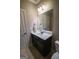 Well-lit bathroom with sleek vanity, modern fixtures, and neutral color palette at 6248 Sunshine Cove Ln, Buford, GA 30518