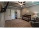 Warm Bedroom with crib, chair, and ample storage space at 6248 Sunshine Cove Ln, Buford, GA 30518
