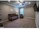 Comfortable Bedroom with crib, chair, and soft carpeting at 6248 Sunshine Cove Ln, Buford, GA 30518