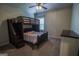 Comfortable bedroom featuring carpeted floors and a charming bunk bed with a fan overhead at 6248 Sunshine Cove Ln, Buford, GA 30518