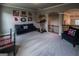 Spacious bonus room with carpet, arched doorways, and natural light, perfect for recreation or relaxation at 6248 Sunshine Cove Ln, Buford, GA 30518