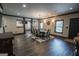 Dining room with large table, windows, lighting and wood-look floors at 6248 Sunshine Cove Ln, Buford, GA 30518