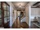 Inviting entryway with hardwood floors, elegant chandelier, and staircase leading to the upper level at 6248 Sunshine Cove Ln, Buford, GA 30518