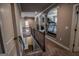 Upper hallway leading to an exercise room with treadmill at 6248 Sunshine Cove Ln, Buford, GA 30518