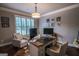 Home office featuring shuttered windows, a neutral color scheme, and a modern desk setup at 6248 Sunshine Cove Ln, Buford, GA 30518