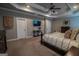 Spacious main bedroom featuring trey ceilings, neutral walls, and decorative furniture at 6248 Sunshine Cove Ln, Buford, GA 30518