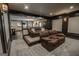 Finished basement theater room featuring leather reclining chairs on tiered platforms at 6248 Sunshine Cove Ln, Buford, GA 30518