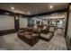 Finished basement theater room featuring leather reclining chairs on tiered platforms at 6248 Sunshine Cove Ln, Buford, GA 30518
