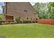 Spacious backyard featuring well-maintained lawn, privacy fence, and mature landscaping at 50 Star Spangled Ln, Peachtree City, GA 30269