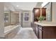 Elegant bathroom featuring a soaking tub, tiled shower, dual vanities, and natural light from the window at 50 Star Spangled Ln, Peachtree City, GA 30269