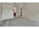 Spacious bedroom with neutral carpet, a double-door closet, and open doorway to an ensuite bathroom at 50 Star Spangled Ln, Peachtree City, GA 30269