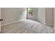 Cozy bedroom featuring neutral carpet, a window with natural light, and ample space at 50 Star Spangled Ln, Peachtree City, GA 30269