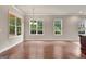 This dining room features hardwood floors, pendant lighting, and large windows at 50 Star Spangled Ln, Peachtree City, GA 30269