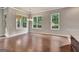 Light-filled dining room showcasing hardwood floors and large windows at 50 Star Spangled Ln, Peachtree City, GA 30269