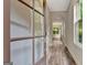 Inviting foyer featuring wood-look floors, an arched entryway and glass paneled front door, offering a bright entrance at 50 Star Spangled Ln, Peachtree City, GA 30269