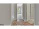 Hallway view to a bedroom and bath with a view of the floors and doors at 50 Star Spangled Ln, Peachtree City, GA 30269