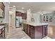 Spacious kitchen featuring a large island, stainless steel appliances, modern cabinets and a view into the living area at 50 Star Spangled Ln, Peachtree City, GA 30269