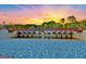 Lake Peachtree spillway with a stone embankment and a scenic sunset at 50 Star Spangled Ln, Peachtree City, GA 30269