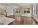 Bright living room with hardwood floors, a ceiling fan, and large windows at 50 Star Spangled Ln, Peachtree City, GA 30269
