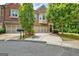 Charming townhome with brick facade, two-car garage, and well-manicured front yard at 50 Star Spangled Ln, Peachtree City, GA 30269