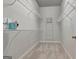 Spacious walk-in closet with wire shelving and carpeted floor providing ample storage space at 50 Star Spangled Ln, Peachtree City, GA 30269
