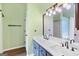 Double sink vanity in bathroom with framed mirror and bright lighting at 147 Calico Loop, Grantville, GA 30220