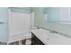 Bright bathroom featuring a large mirror and a clean white tub at 147 Calico Loop, Grantville, GA 30220