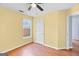 Comfortable bedroom featuring a ceiling fan, window, and interior door at 147 Calico Loop, Grantville, GA 30220