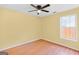 Bright bedroom with hardwood floors and a ceiling fan at 147 Calico Loop, Grantville, GA 30220