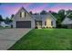 Charming one-story home with a well-manicured lawn and attached two-car garage at 147 Calico Loop, Grantville, GA 30220