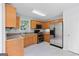 Well-equipped kitchen with stainless steel refrigerator, oven, and plenty of storage space at 147 Calico Loop, Grantville, GA 30220
