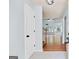 Open-concept living room with hardwood floors and a view of the staircase at 147 Calico Loop, Grantville, GA 30220