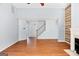 Spacious living room with hardwood floors, fireplace, and staircase at 147 Calico Loop, Grantville, GA 30220