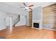 Inviting living room showcasing a fireplace, staircase, and hardwood floors at 147 Calico Loop, Grantville, GA 30220