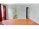 A view of the main bedroom showcasing access to walk-in closet and ensuite bathroom at 147 Calico Loop, Grantville, GA 30220