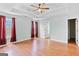 Spacious main bedroom with tray ceilings, hardwood floors, and large windows for natural light at 147 Calico Loop, Grantville, GA 30220
