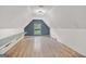 Large bonus room featuring hardwood floors and a window at 147 Calico Loop, Grantville, GA 30220