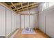The shed interior has an open floorplan with a pegboard and storage hangers at 147 Calico Loop, Grantville, GA 30220