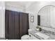 Cozy bathroom with a shower and granite countertop sink with decorative faucet at 266 Hanover Dr, Villa Rica, GA 30180